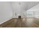 Open-concept living room with hardwood floors, a fireplace, and a chandelier at 5377 River Buck Rd, Spring Hope, NC 27882