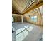 Spacious unfinished room featuring exposed wood framing, a window, and natural light, ready for customization at 5377 River Buck Rd, Spring Hope, NC 27882