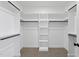 Large walk-in closet with custom shelving and ample storage, designed for optimal organization and convenience at 5377 River Buck Rd, Spring Hope, NC 27882