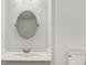 Clean bathroom with oval mirror and updated vanity at 550 Pine Ridge Pl, Raleigh, NC 27609