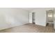Simple bedroom with wood-look floors and access to a small bathroom at 550 Pine Ridge Pl, Raleigh, NC 27609