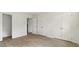 Bedroom with wood-look floors and double closets and access to laundry at 550 Pine Ridge Pl, Raleigh, NC 27609
