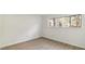 Simple bedroom with wood-look floors and a window with wooded views at 550 Pine Ridge Pl, Raleigh, NC 27609