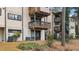 Rear view of the building with private patios at 550 Pine Ridge Pl, Raleigh, NC 27609