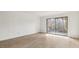 Living room with sliding glass door leading to outdoor space at 550 Pine Ridge Pl, Raleigh, NC 27609