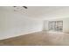 Living room with sliding doors to a private balcony at 550 Pine Ridge Pl, Raleigh, NC 27609