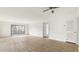 Living room with sliding glass door to balcony and ceiling fan at 550 Pine Ridge Pl, Raleigh, NC 27609