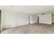 Spacious living room with light walls and wood-look floors at 550 Pine Ridge Pl, Raleigh, NC 27609
