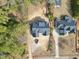 An aerial view of a home with a striking roof design situated on a spacious lot at 5820 Shawood Dr, Raleigh, NC 27609