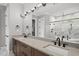 Spacious bathroom with dual sinks, modern fixtures, soaking tub, glass shower, and elegant finishes at 5820 Shawood Dr, Raleigh, NC 27609