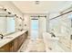 Elegant bathroom features a freestanding tub, dual vanities, and a glass shower at 5820 Shawood Dr, Raleigh, NC 27609