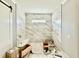 Modern bathroom features marble tiling, a built-in shower bench, and contemporary fixtures at 5820 Shawood Dr, Raleigh, NC 27609