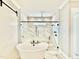 Modern bathroom showcases a soaking tub and glass-enclosed shower with marble accents at 5820 Shawood Dr, Raleigh, NC 27609
