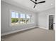 Large bedroom featuring a ceiling fan and open access to an ensuite bathroom at 5820 Shawood Dr, Raleigh, NC 27609