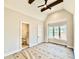 Bedroom featuring ceiling fan, ensuite bathroom, and windows overlooking the outside at 5820 Shawood Dr, Raleigh, NC 27609