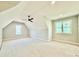 Bedroom with ceiling fan, vaulted ceiling, neutral walls, white trim, and plenty of natural light at 5820 Shawood Dr, Raleigh, NC 27609