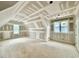 Bright bedroom featuring multiple windows and vaulted ceiling at 5820 Shawood Dr, Raleigh, NC 27609