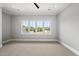 Bright bedroom with large windows offering natural light and views of the neighborhood at 5820 Shawood Dr, Raleigh, NC 27609