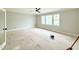 Bedroom with ceiling fan, neutral walls, white trim, and plenty of natural light from three windows at 5820 Shawood Dr, Raleigh, NC 27609