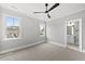 Spacious bedroom with large windows, a ceiling fan and an ensuite bathroom at 5820 Shawood Dr, Raleigh, NC 27609