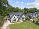 Striking two-story home with a manicured front lawn and a three-car garage at 5820 Shawood Dr, Raleigh, NC 27609