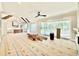 Open-concept living space with kitchen, fireplace, and sliding doors to the outdoor space at 5820 Shawood Dr, Raleigh, NC 27609