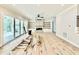 Bright living room features a fireplace, large sliding doors, and built-in shelving at 5820 Shawood Dr, Raleigh, NC 27609