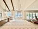 Open-concept kitchen with island and view into living room featuring fireplace and built-in cabinets at 5820 Shawood Dr, Raleigh, NC 27609