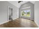 Main bedroom with vaulted ceilings, large window and an ensuite bathroom at 5820 Shawood Dr, Raleigh, NC 27609