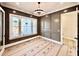 Sophisticated office space featuring paneled walls, windows, and modern lighting at 5820 Shawood Dr, Raleigh, NC 27609