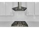 Stainless steel gas cooktop with white tile backsplash at 6134 Giddings St, Raleigh, NC 27616