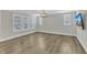 Bright living room with hardwood floors, large windows, and recessed lighting at 6134 Giddings St, Raleigh, NC 27616