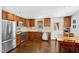 Modern kitchen with stainless steel appliances and dark wood cabinetry at 717 Dorothea Dr, Raleigh, NC 27603