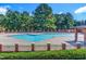 Community pool with brick border and surrounding seating at 72 Florentino Ct, Clayton, NC 27527