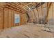 Unfinished attic space with window and wood framing at 72 Florentino Ct, Clayton, NC 27527