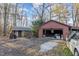 Brick garage and wooden shed in the backyard at 73 Brake Rd, Rocky Mount, NC 27801