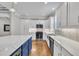 Modern kitchen with stainless steel appliances and white cabinets at 7505 Nichols Rd, Raleigh, NC 27615