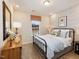 Cozy bedroom with a metal bed frame, stylish bedding, and a unique wall accent at 908 Thimbleweed Way, Wake Forest, NC 27587