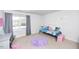 Bedroom with twin bed, desk, and purple rug at 98 Panmure, Rocky Mount, NC 27804
