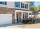 Two-story house with stone accents and a covered porch at 98 Panmure, Rocky Mount, NC 27804