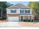 Two-story house with stone accents and a two-car garage at 98 Panmure, Rocky Mount, NC 27804