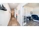 Bright hallway with hardwood floors and access to rooms at 98 Panmure, Rocky Mount, NC 27804