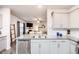 Open concept kitchen island with granite countertops and stainless steel dishwasher at 98 Panmure, Rocky Mount, NC 27804