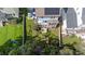 Aerial view of the backyard with a large lawn and play structure, surrounded by a wooden fence at 1000 Norris St, Raleigh, NC 27604