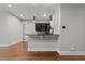 Modern bar area with dark cabinetry and granite countertop at 1000 Norris St, Raleigh, NC 27604