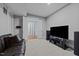 Finished basement area featuring a comfortable couch and entertainment center at 1000 Norris St, Raleigh, NC 27604