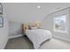 Angled bedroom featuring a comfortable bed, carpet and a view from the window at 1000 Norris St, Raleigh, NC 27604