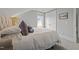 Cozy bedroom featuring a bed, pillows and view from window at 1000 Norris St, Raleigh, NC 27604
