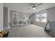 Angled bonus room with desk, ceiling fan and carpet at 1000 Norris St, Raleigh, NC 27604