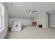 Bonus room featuring carpet floors, neutral walls, and wall-to-wall storage cabinets at 1000 Norris St, Raleigh, NC 27604